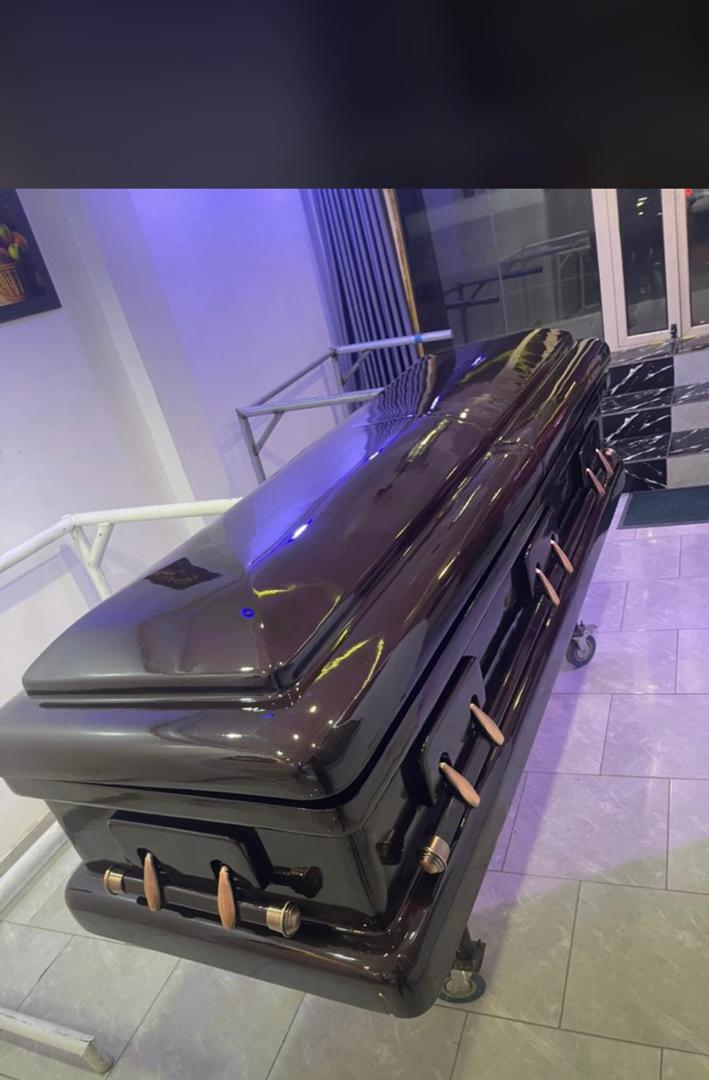 Espresso Gloss Casket — Foreign Caskets available at Vanity Funeral Home, Lagos