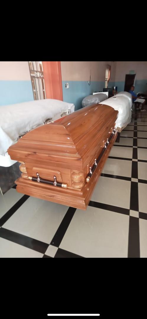 Golden Oak Dome Casket — Local Caskets available at Vanity Funeral Home, Lagos